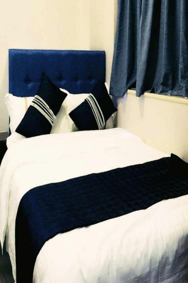 Capital Guest House Цзюлун Экстерьер фото